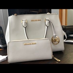 White Michael Kors purse and wallet